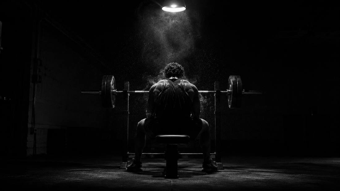 Athlete training alone in an empty gym in the early morning