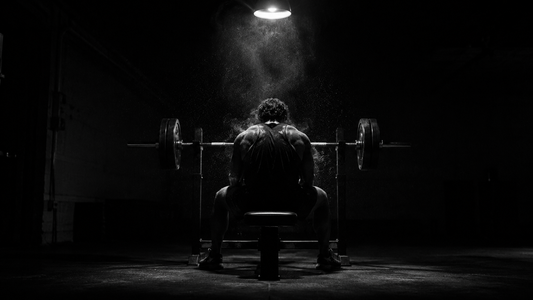 Athlete training alone in an empty gym in the early morning