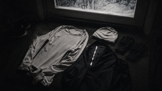 Cold weather running gear laid out for a winter morning run